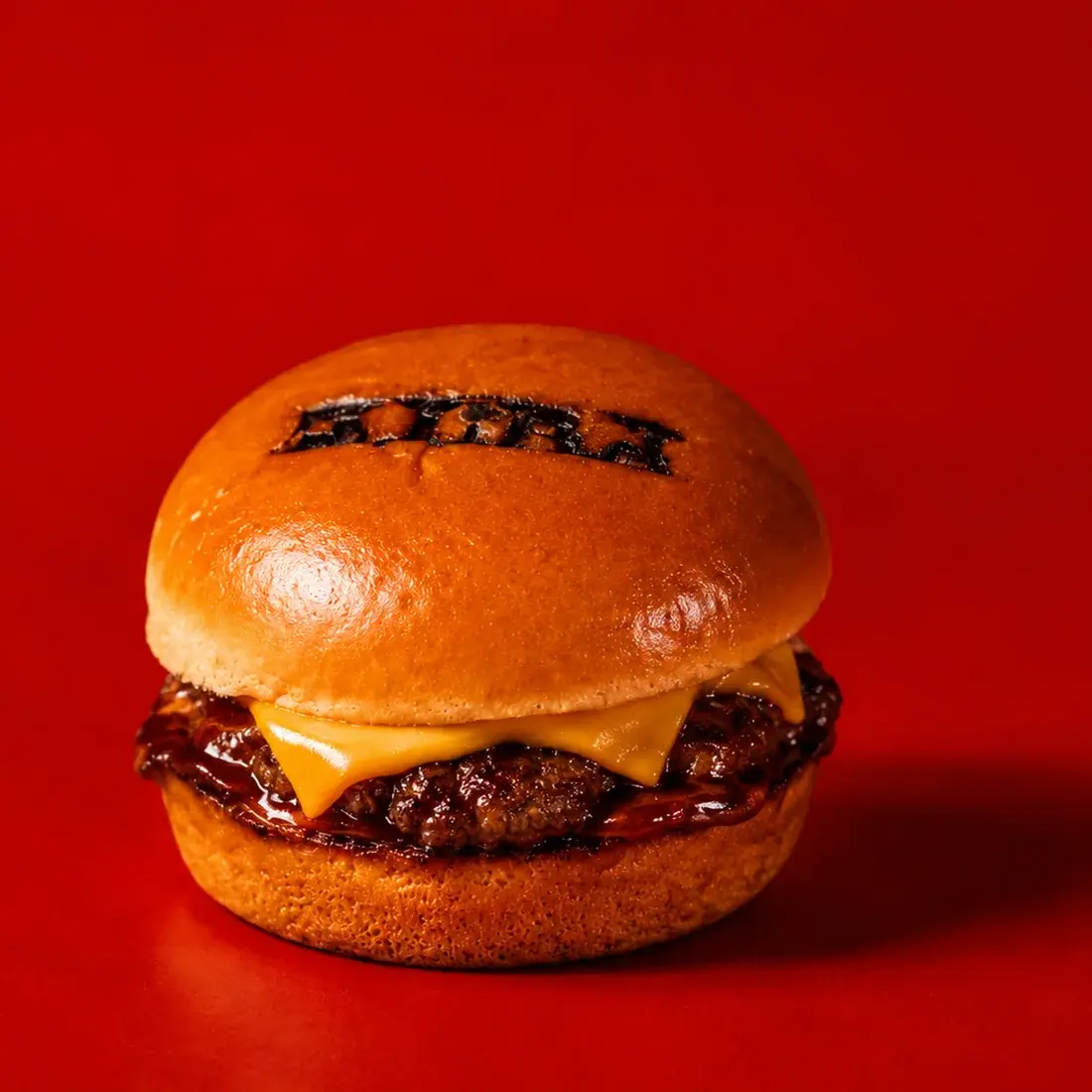 Classic Wagyu Cheeseburger Slider on a branded Alba Street brioche bun, shot against a red backdrop at Alba Street, Social Distrikt, Dubai Mall