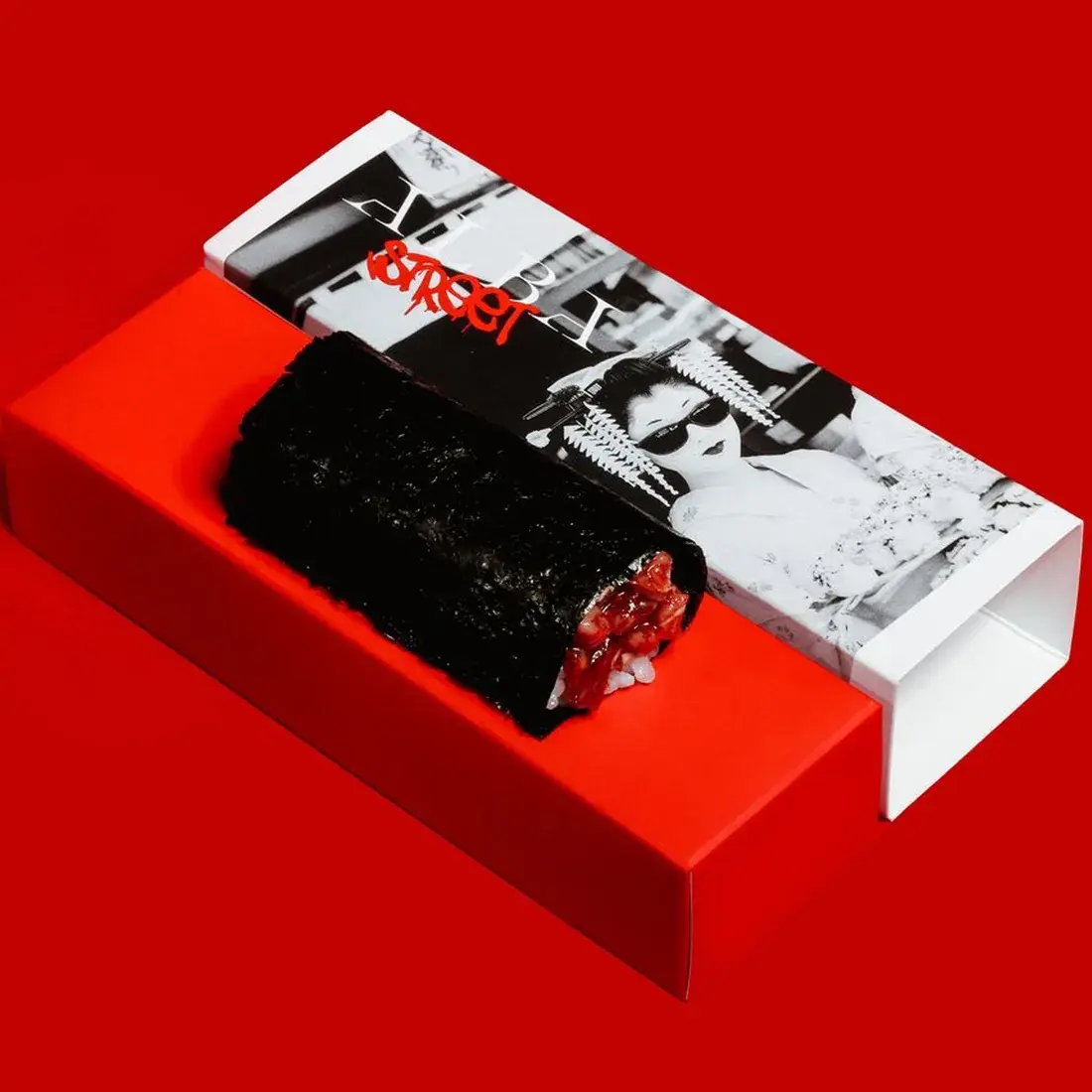 A5 Wagyu Handroll in an Alba Street presentation box against a red backdrop at Alba Street, Social Distrikt, Dubai Mall