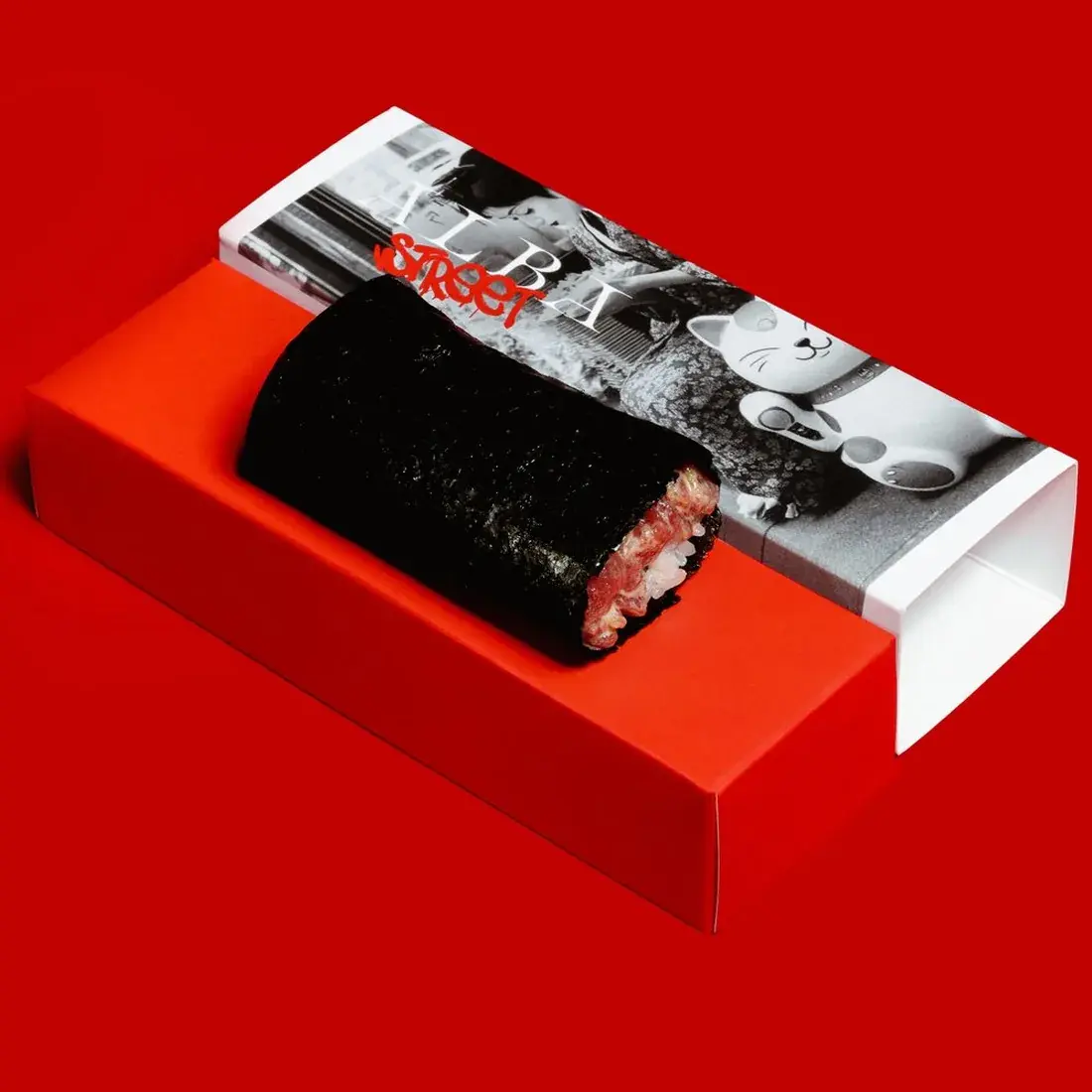Tuna Akami Handroll in an Alba Street presentation box against a red backdrop at Alba Street, Social Distrikt, Dubai Mall