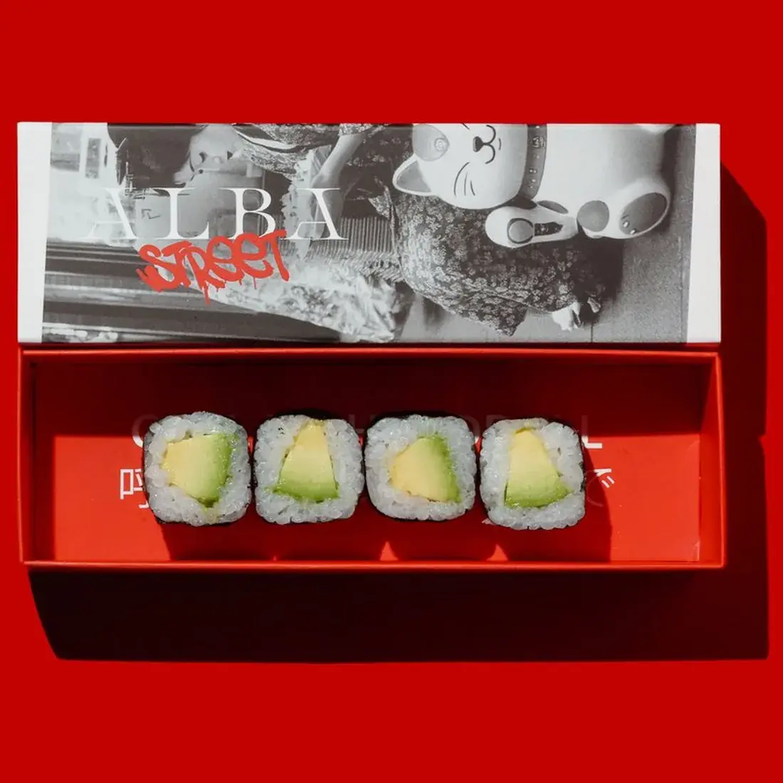 Avocado Maki Roll in an Alba Street presentation box against a red backdrop at Alba Street, Social Distrikt, Dubai Mall