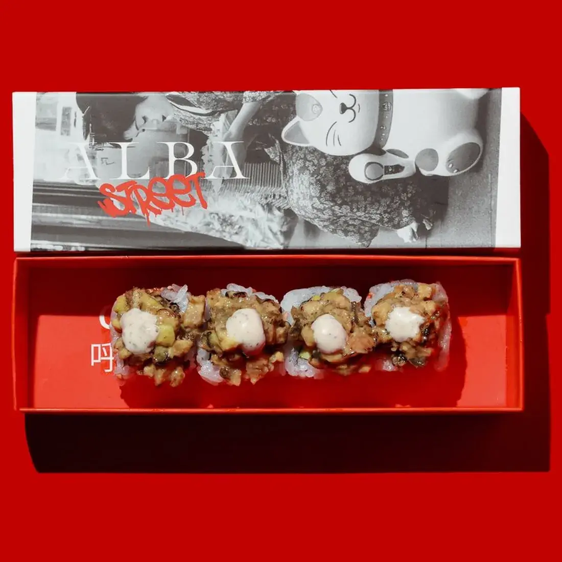 Dragon Maki Roll in an Alba Street presentation box against a red backdrop at Alba Street, Social Distrikt, Dubai Mall
