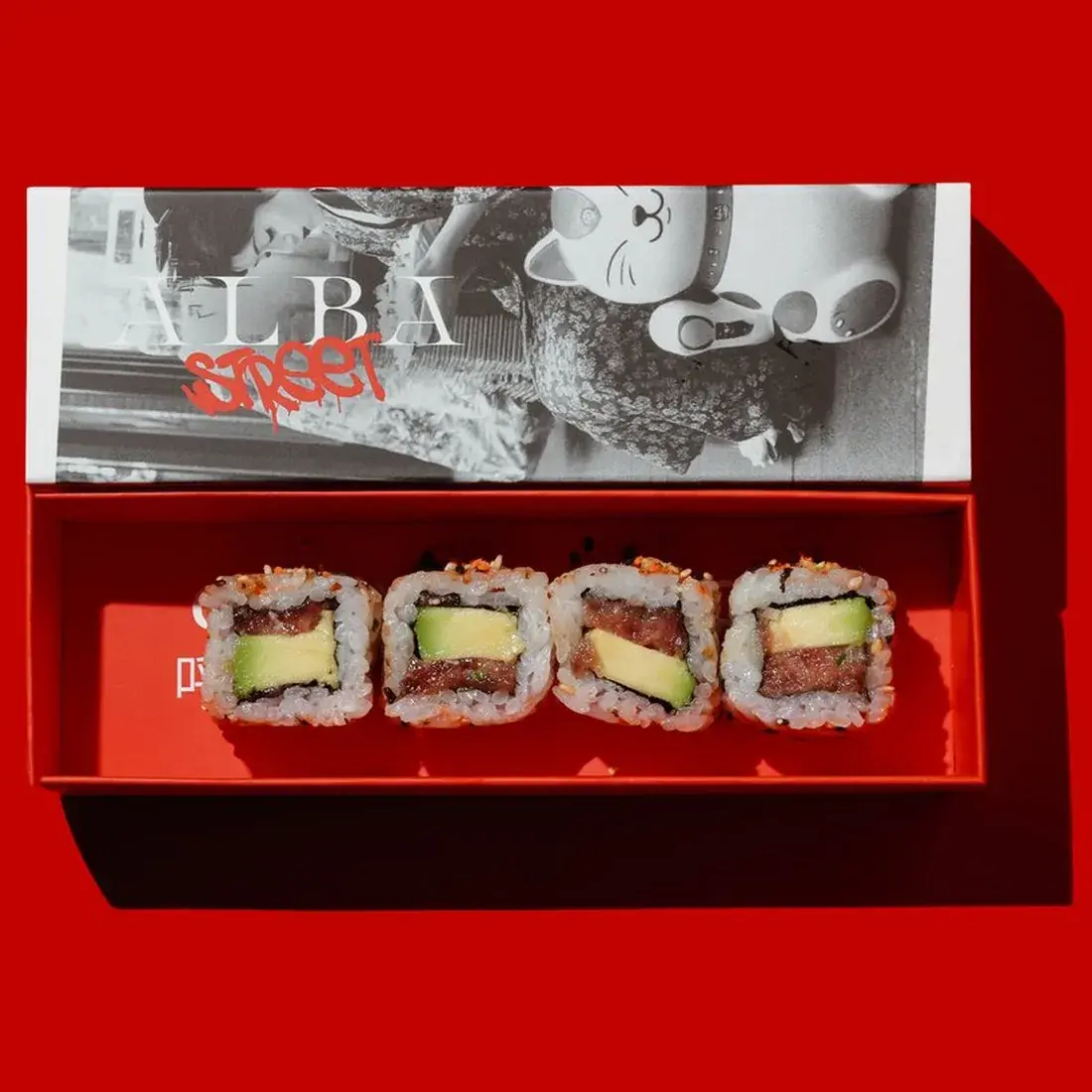 Spicy Tuna Maki Roll in an Alba Street presentation box against a red backdrop at Alba Street, Social Distrikt, Dubai Mall