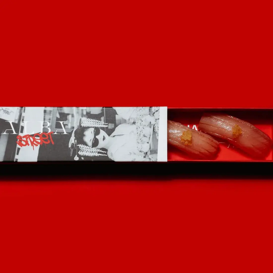 Yellowtail Hamachi Nigiri – 2 Pcs in an Alba Street presentation box against a red backdrop at Alba Street, Social Distrikt, Dubai Mall