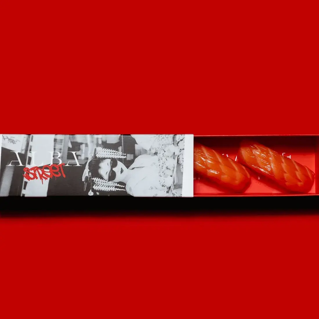 Salmon Nigiri – 2 Pcs in an Alba Street presentation box against a red backdrop at Alba Street, Social Distrikt, Dubai Mall