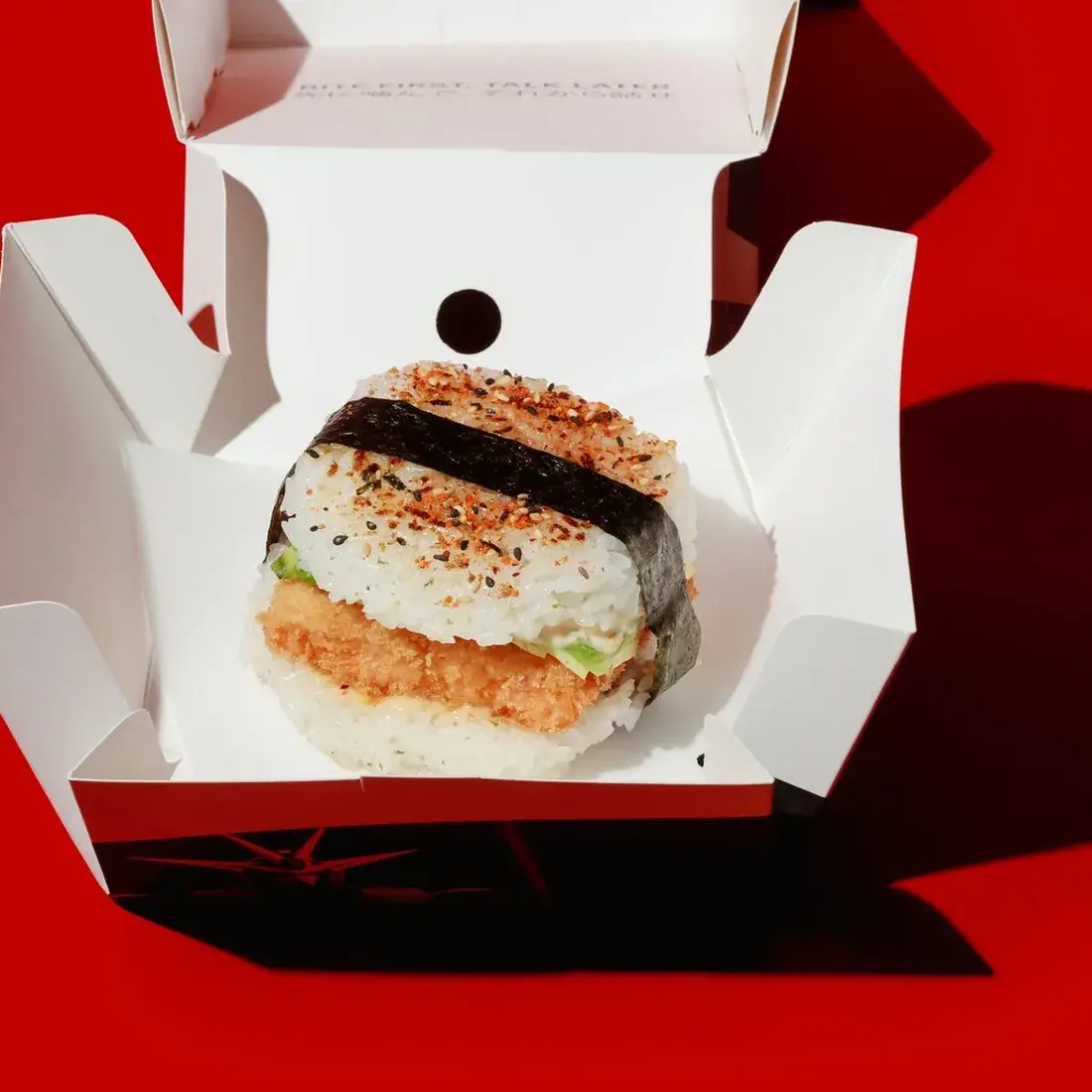 Salmon Sushi Burger in an open Alba Street takeaway box against a red backdrop at Alba Street, Social Distrikt, Dubai Mall