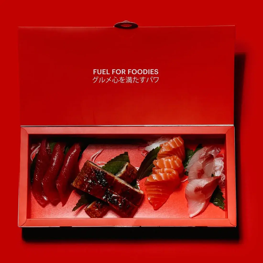 Sashimi Box 12 Pcs in an Alba Street presentation box against a red backdrop at Alba Street, Social Distrikt, Dubai Mall