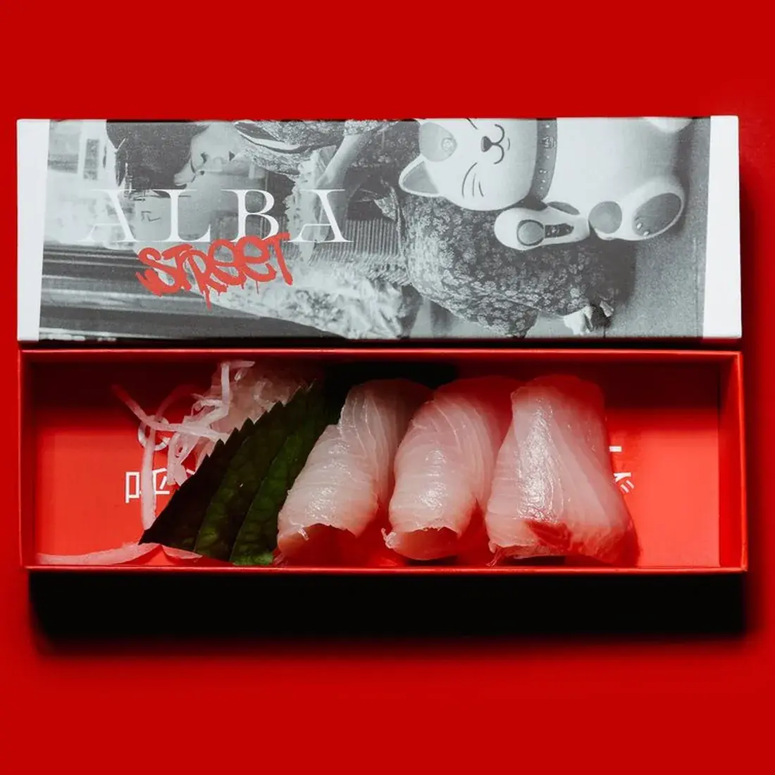 Yellowtail Hamachi Sashimi – 3 Pcs in an Alba Street presentation box against a red backdrop at Alba Street, Social Distrikt, Dubai Mall