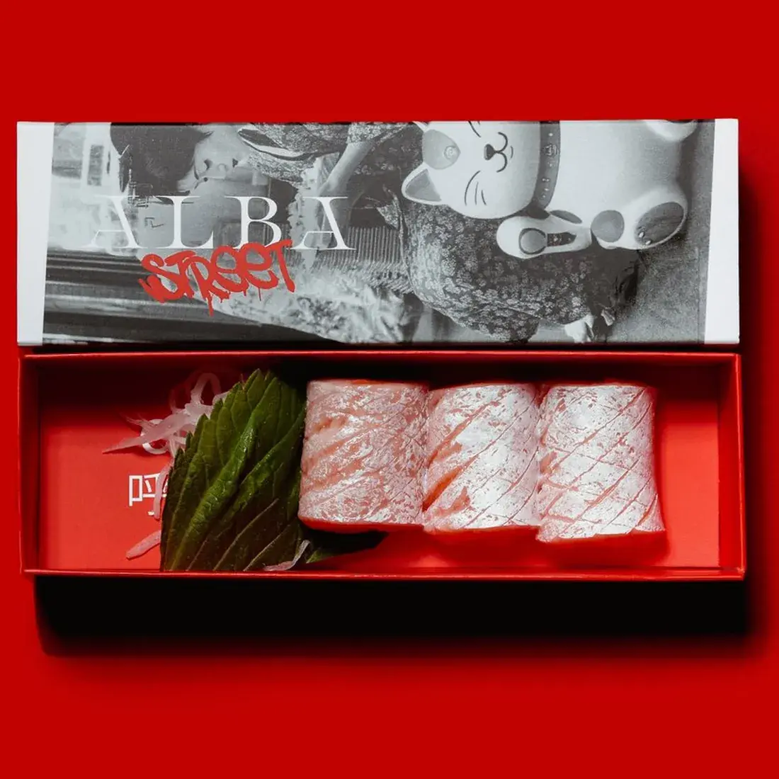 Salmon Belly Sashimi – 3 Pcs in an Alba Street presentation box against a red backdrop at Alba Street, Social Distrikt, Dubai Mall