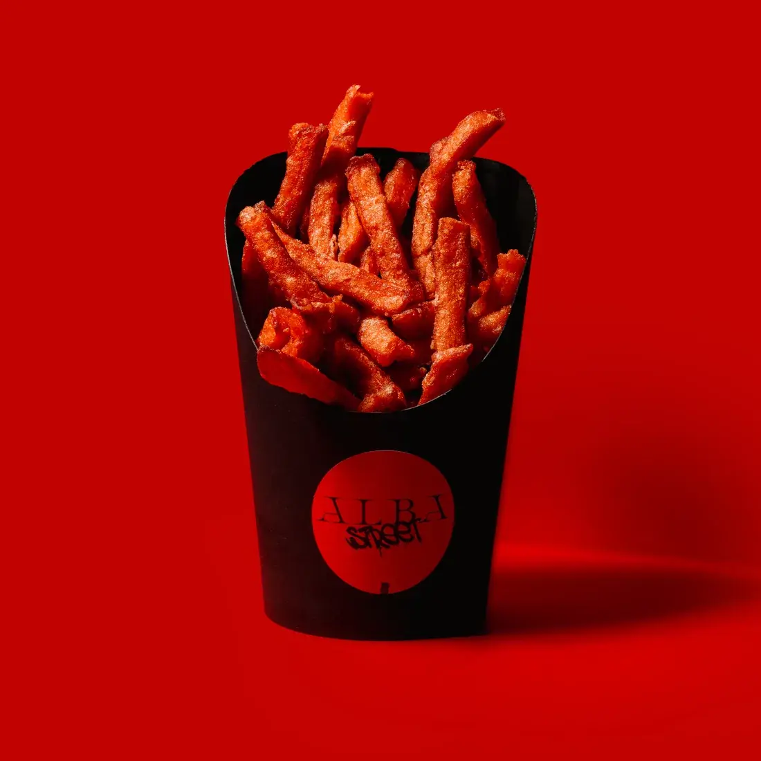 Sweet Potato Street Fries in a black Alba Street carton against a red backdrop at Alba Street, Social Distrikt, Dubai Mall