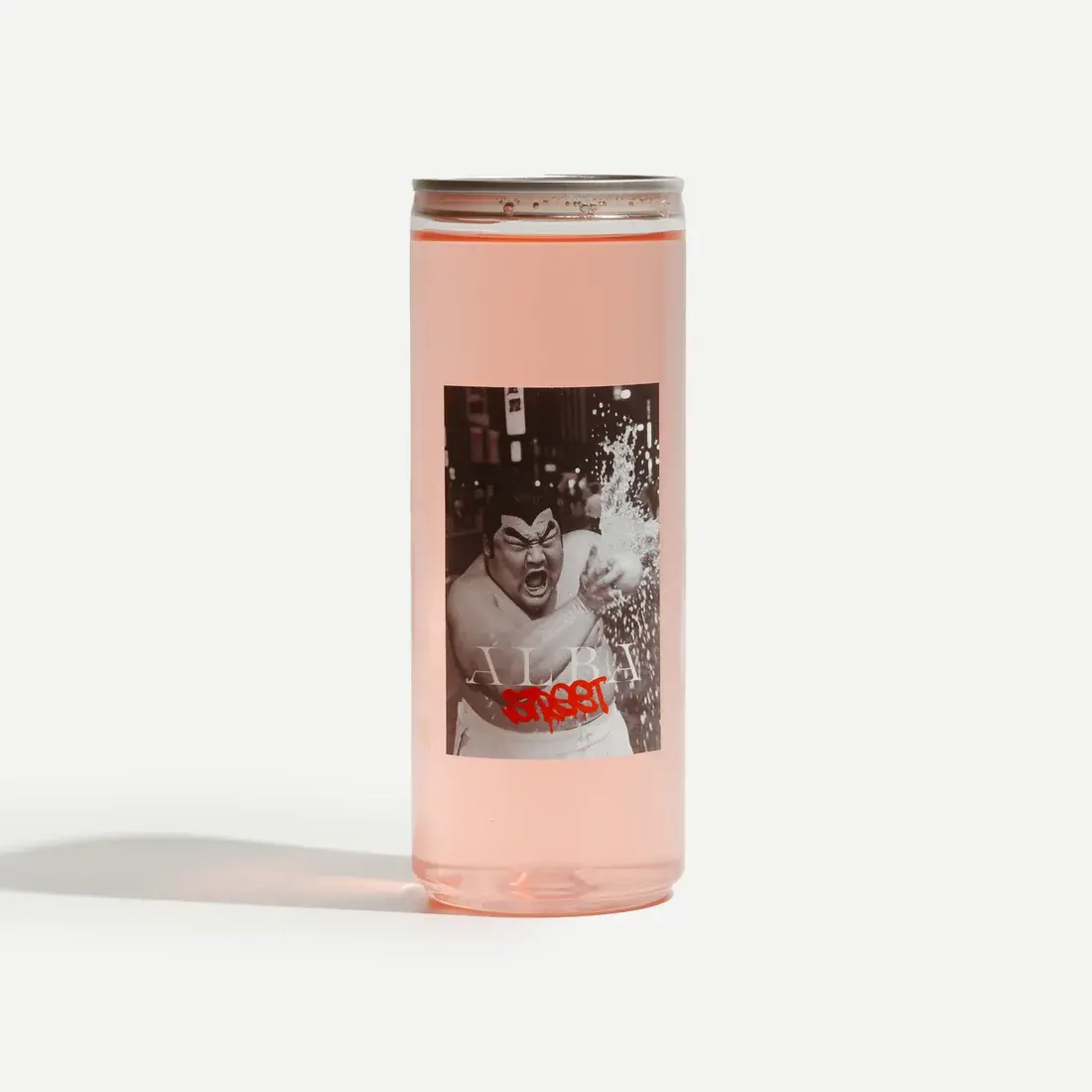 Street Peach Oolong in a 330ml Alba Street can on a pale backdrop, the peach-pink cold brew visible through the glass