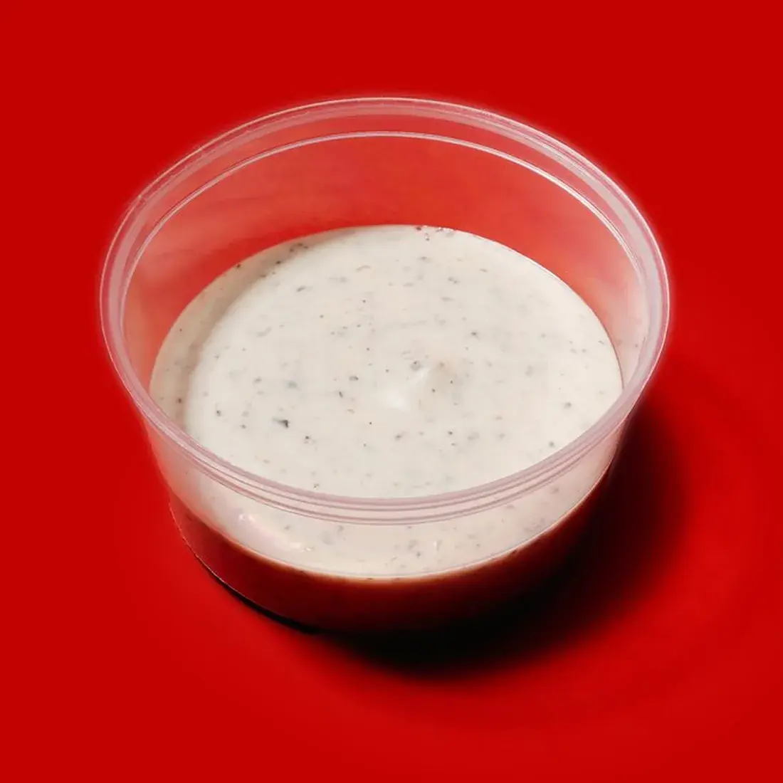 Truffle Mayo Sauce in a dip pot against a red backdrop at Alba Street, Social Distrikt, Dubai Mall